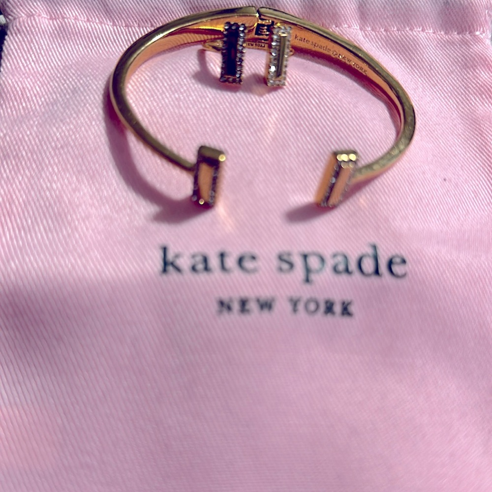 Ring and bracelet set, gold color.